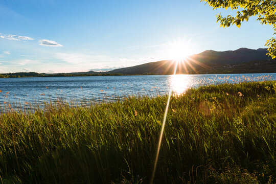 Spring sunset on the shores of Lake Pusiano, near the town of Bosisio Parini, Italy - May 2021.