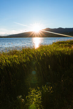 Spring sunset on the shores of Lake Pusiano, near the town of Bosisio Parini, Italy - May 2021.