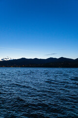 The blue hour on the shores of Lake Pusiano: a small lake in Brianza, Lombardy, Italy - May 2021.