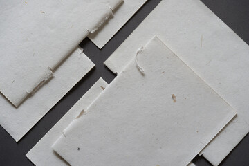 pages of a blank diary torn out and layered over one another