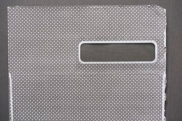security envelope or envelope roughly split open to reveal the curious cross-hatched design or pattern inside