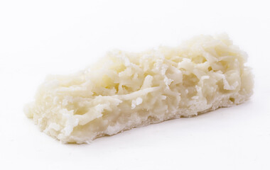 typical Brazilian sweet, called cocada, made at home. Isolated white background with copy space