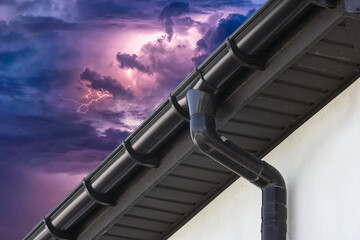 Storm sky with lightning over the house.