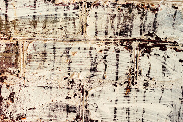Texture of a brick wall with cracks and scratches which can be used as a background