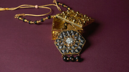 Indian traditional antique or retro style pendant on black background.
