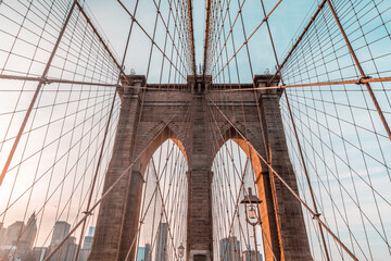 New York and Brooklyn bridge close up with Manhattan skyscrapers on background