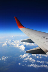 Wing aircraft in the blue sky
