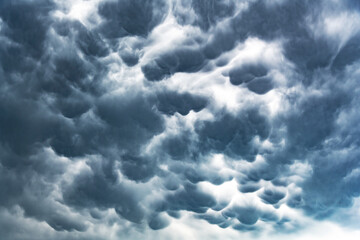 Dramatic dark rainy cloudy stormy sky as abstract background.