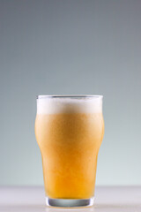 Craft beer with foam forming in the glass