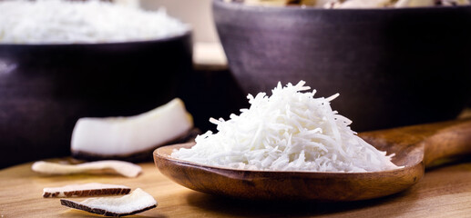 grated coconut wooden spoon, coconut-based ingredient