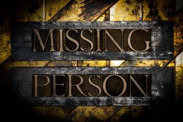 Missing Person text on vintage textured grunge lead copper and gold bar background