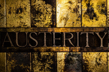 Austerity text on vintage textured copper and gold background