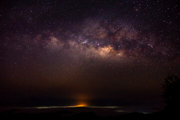 Milky Way Galaxy and fog over Kong city ,Chiang mai, Thailand