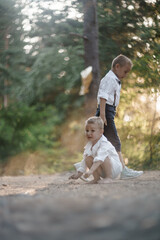 Fototapeta premium two little boys are playing outside