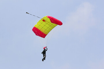 Skydiver in a blue sky	