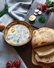 Traditional okroshka soup on kefir with egg and dill.  ingredients for okroshka on the table