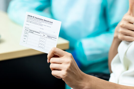 Middle-aged Woman Holding A Vaccination Record Card Vaccinated Coronavirus, Concept Coronavirus Vaccination