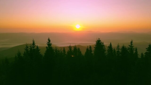 Blue fog over the mountains, sunrise in the Carpathian mountains 