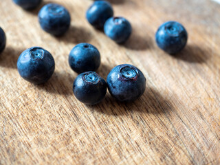 Close-up of ripe delicious blueberries on a wooden background. Healthy natural products, vitamins. selective focus.