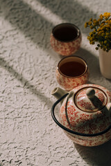 top view of tea and tea set on concrete background 