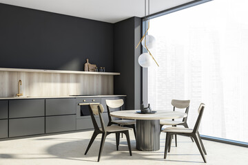 Dark grey kitchenroom corner with panoramic view, light wooden furniture