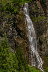 Fototapeta na wymiar Schleierfall waterfall near Sportgastein place between big mountains