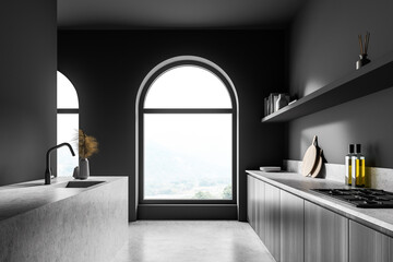 Dark area with arch windows, side view of the kitchen cabinet,