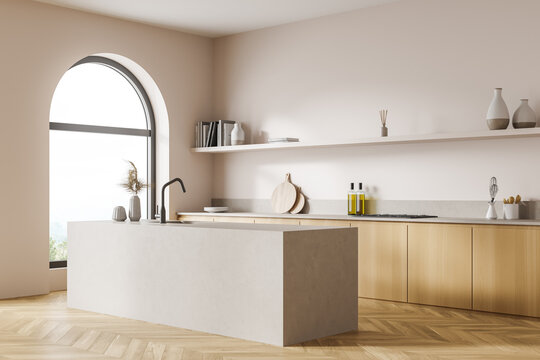 Corner view of the double sided kitchen cabinet, light beige