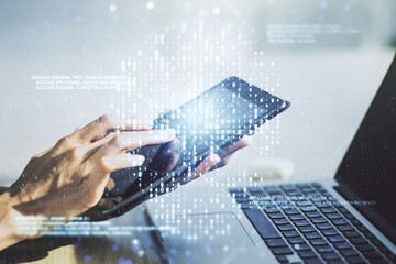 Creative concept of code skull illustration and finger clicks on a digital tablet on background. Hacking and phishing concept. Multiexposure