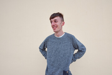 A portrait of a happy Caucasian male from Spain on plain background