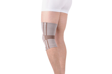 Knee Support Brace on leg isolated on white background. Orthopedic Anatomic Orthosis. Braces for...