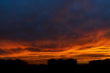 stunning sunset of intense blue and orange colours on a hot summer day in the city of Zaragoza, Spain.