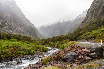 Mountainous Monkey creek flowing through impressive landscape next to Milford Sound highway, New Zealand