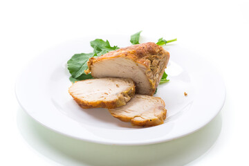 baked chicken fillet pieces with spices and herbs, in a ceramic form