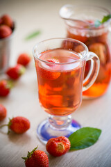 Sweet refreshing berry compote of ripe strawberries in a decanter