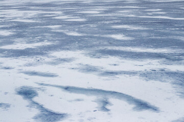 Texture of snow-covered ice on the river after a blizzard. Winter background