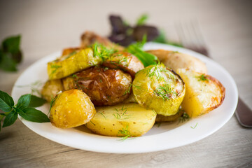 Early baked potatoes with zucchini and chicken
