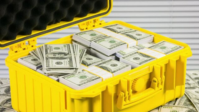 Close up rotation of case full of one million dollars.