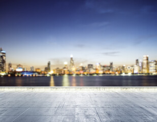 Empty concrete dirty embankment on the background of a beautiful Chicago city skyline at night,...