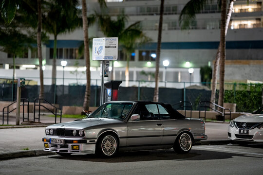 BMW 3 Series Parked In The City At Night