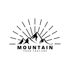 Mountain logo with sun light effect behind