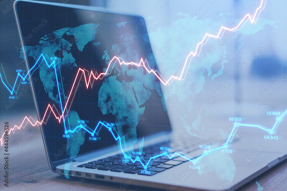 Aufkleber close up of laptop on desktop with abstract forex chart and map. fintech, market and data exchange c