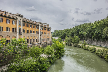 Fototapeta premium Beautiful cityscape along River Tiber in the Rome historic center. Rome, Italy.