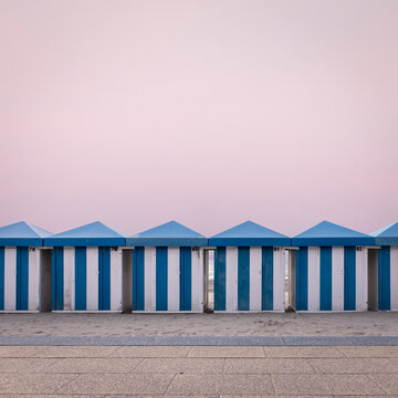 Row of vintage wooden beach huts on the beach of Dunkirk in France