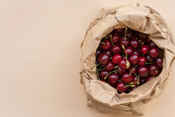 Paper eco-package with fresh large ripe red cherries