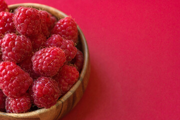 Fresh ripe juicy beautiful raspberries close up copy space