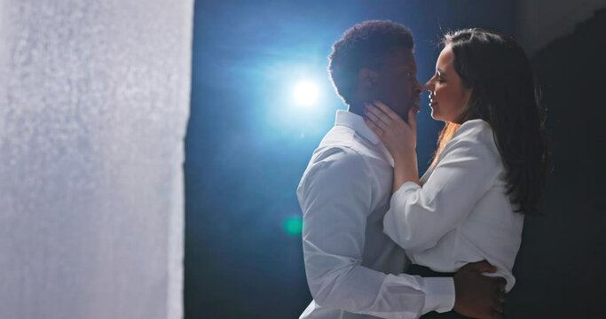 Hidden camera behind the curtains, two people in love dancing a romantic dance, they are very close to each other, express their feelings, emotions, dressed in elegant white shirts