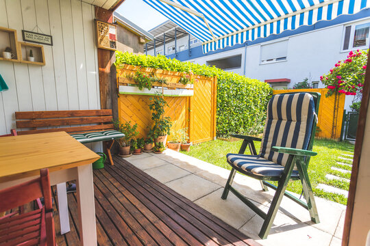 Cozy and homely veranda with little garden, summer time