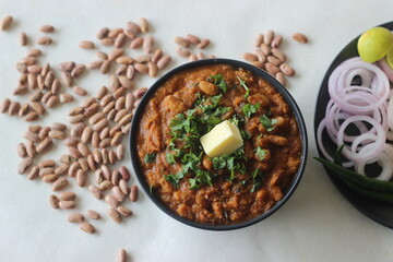 Red kidney beans in a thick and spicy gravy of onions and tomatoes. Commonly known as rajma masala in the northern parts of India