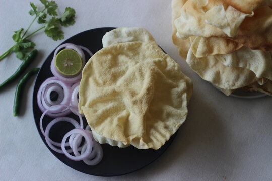 A papadum also called papad is a thin, crisp, round flatbread from India
